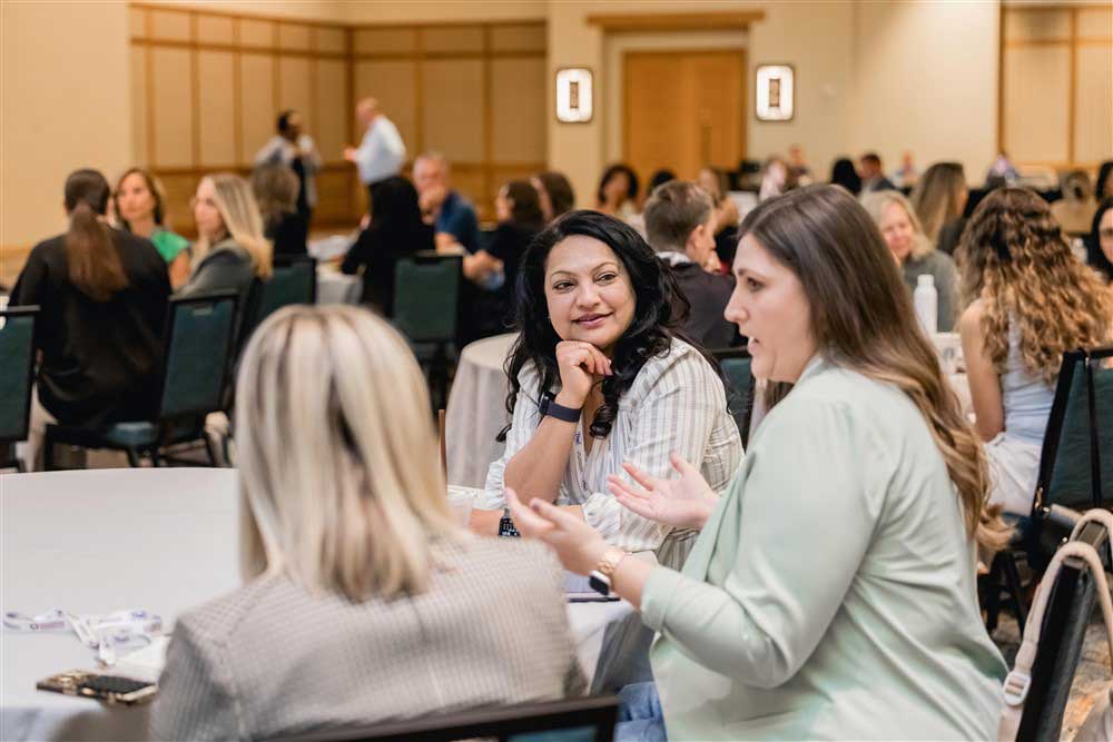 Consumer connection attendees meeting during the conference education session.